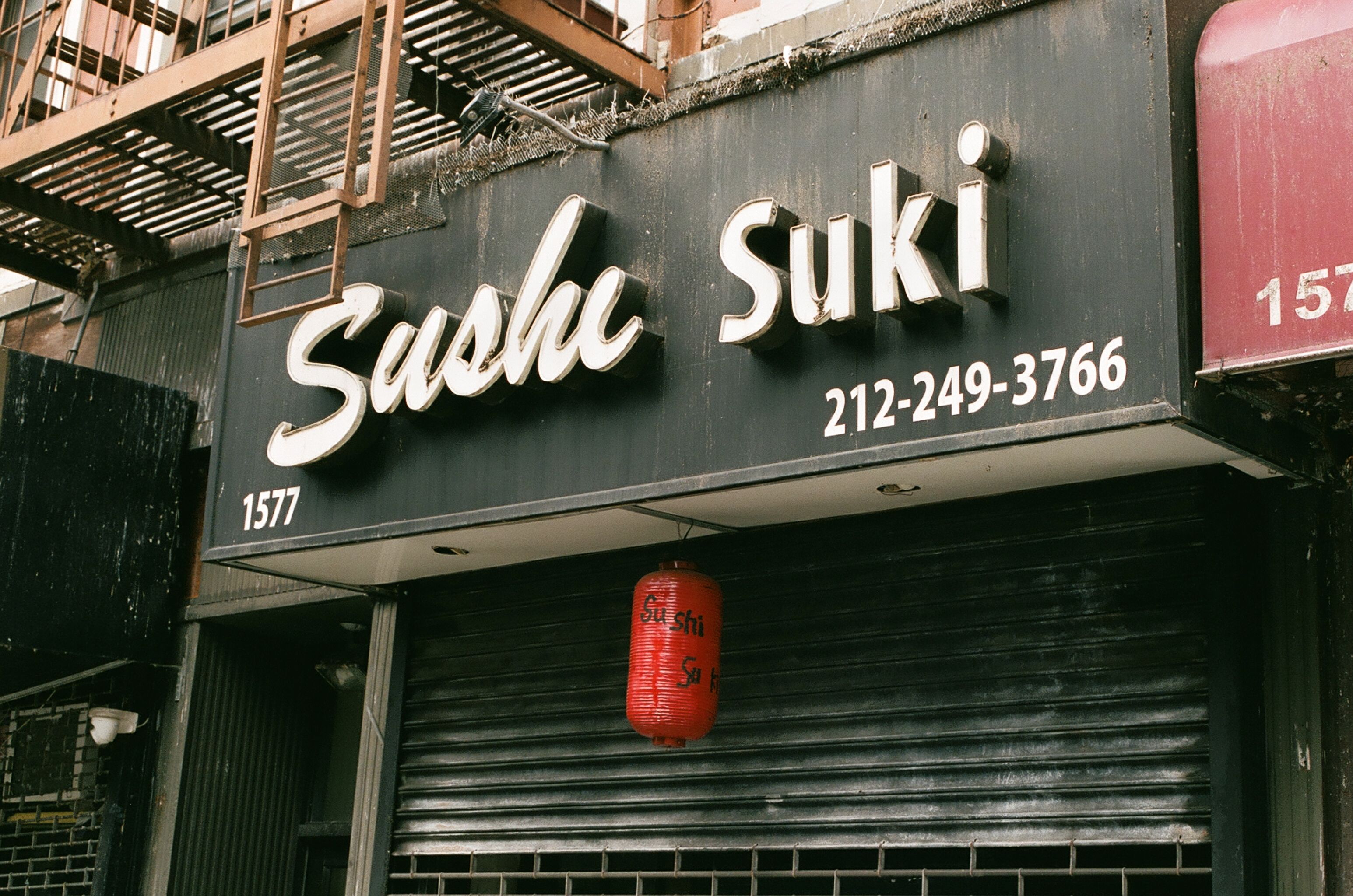 Sushi Suki storefront sign and red lantern