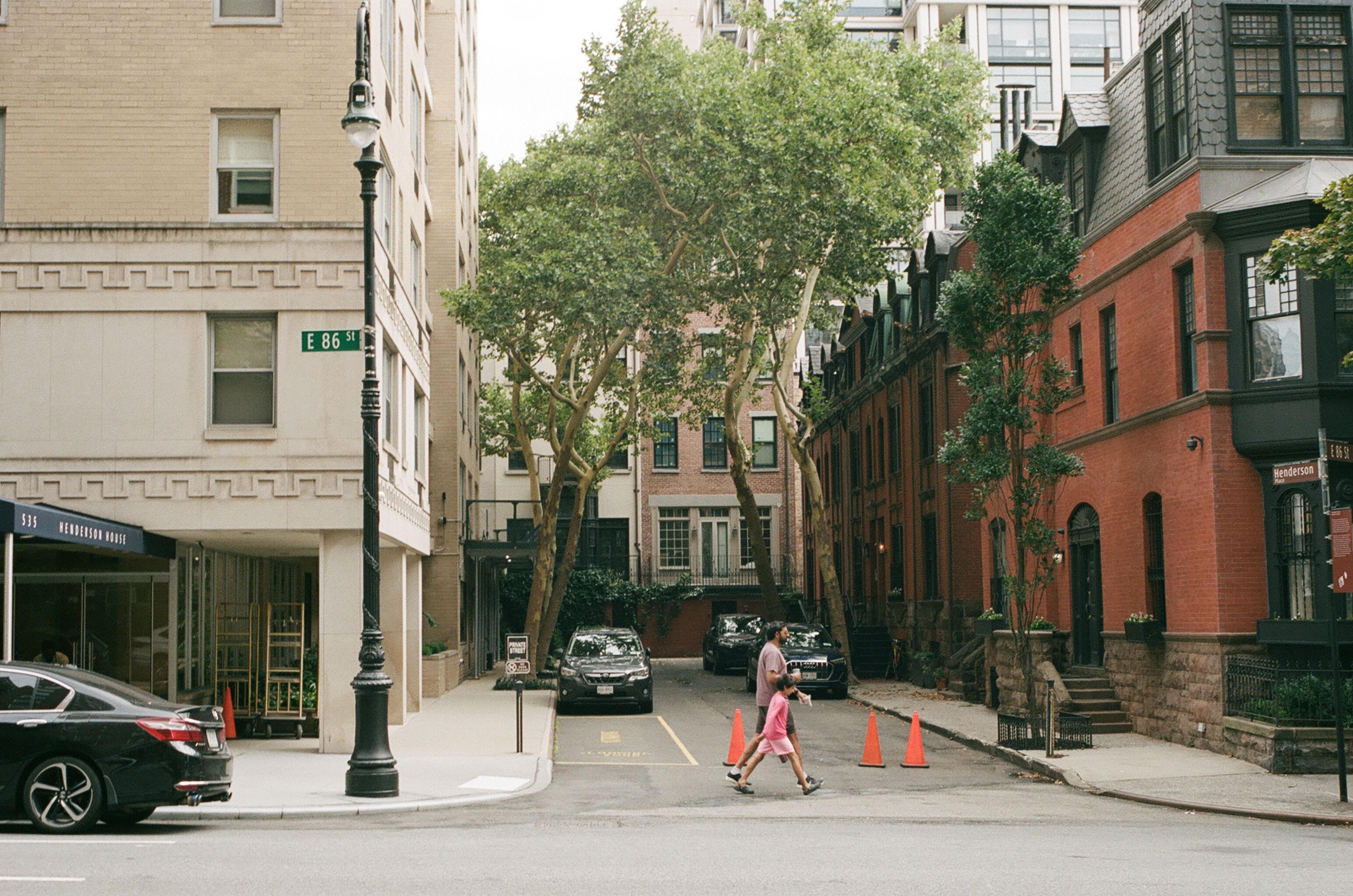 Quiet red-brick side street with a pedestrian