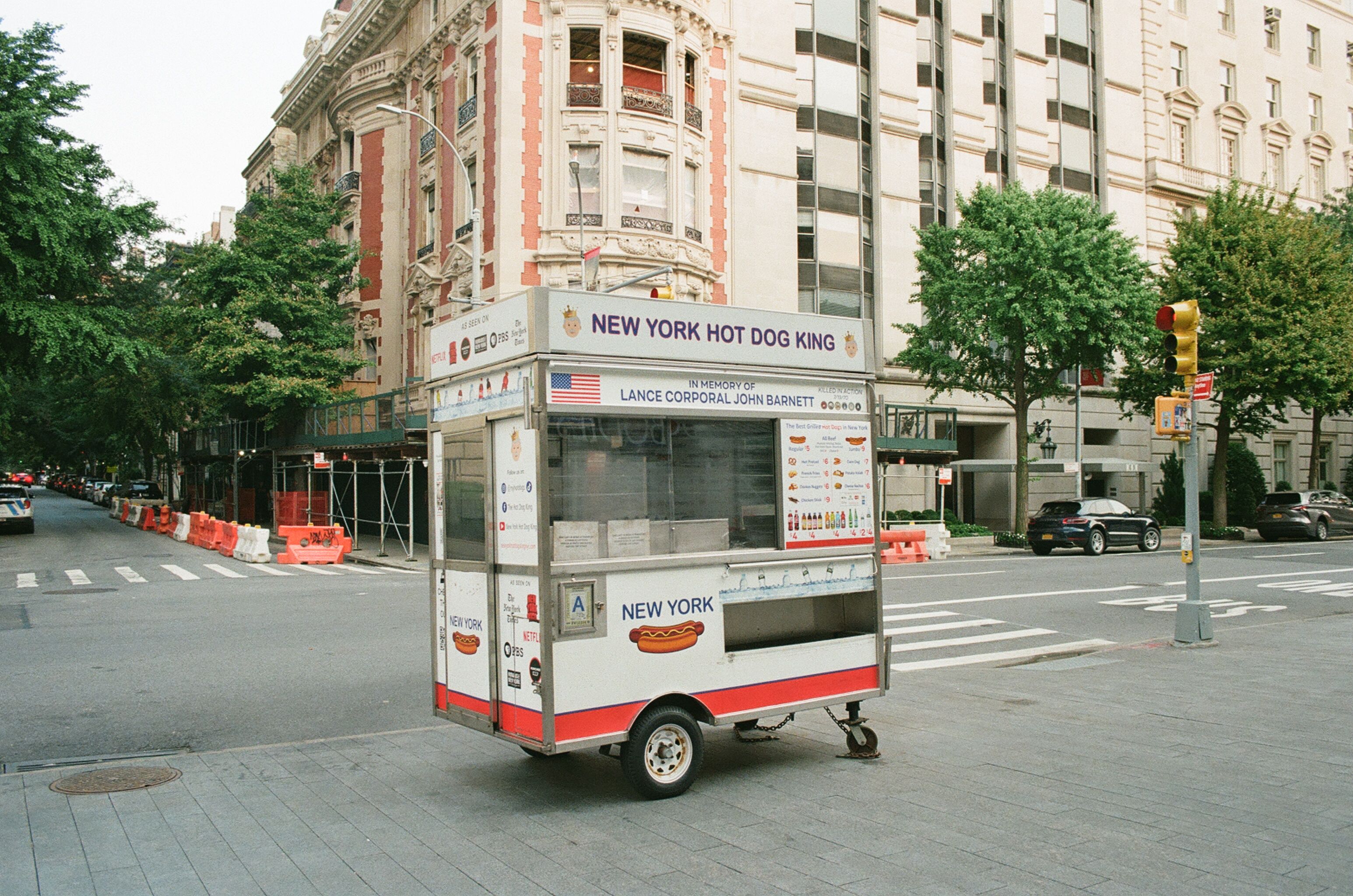 Hot dog cart standing at a quiet New York intersection