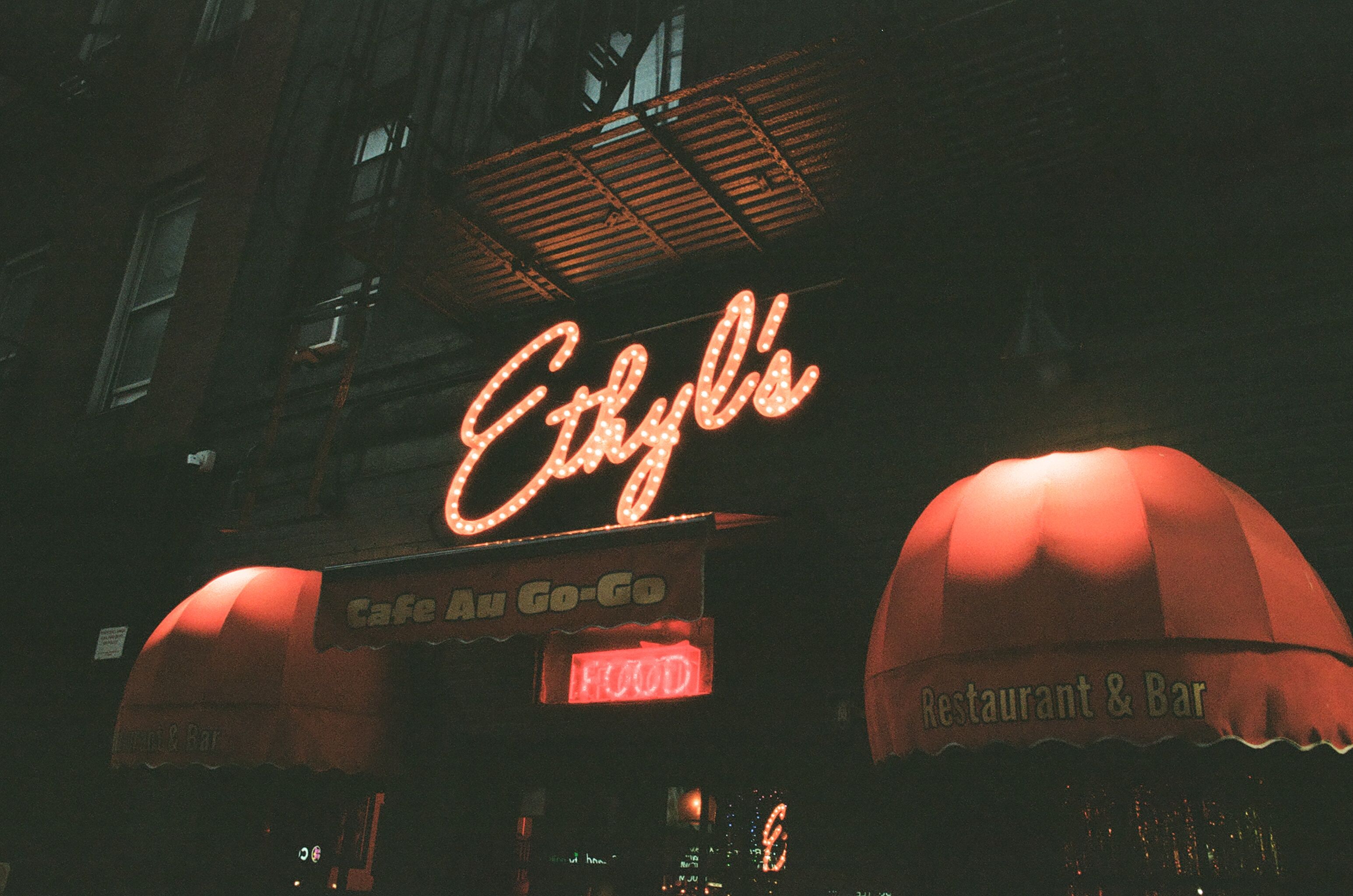 Evelyn's neon sign glowing at night